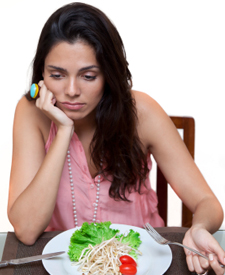 Young woman with a plate of food