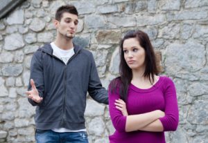 Couple fighting. A young man is apologizing,he's being ignored