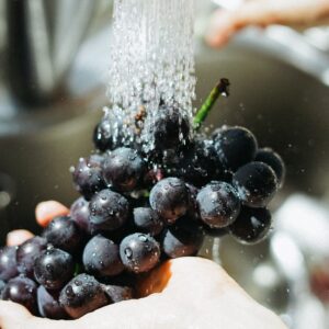 washing grapes with water, food preparation, food prep